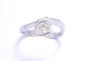 Oval cut diamond ring handmade in platinum by award winning charmian beaton design